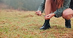 Hiking, mountain and person tie shoes for travel on adventure, journey and walking in nature. Mockup space, fitness and legs of woman with laces for exercise, workout and trekking on outdoor hike