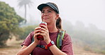 Trekking, woman and coffee in nature on adventure, thinking and relax with fog or vision. Hiking, flask and person outdoor with hot beverage, tea drink or travel with reflection on vacation in forest