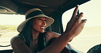 Road trip, picture and woman with smartphone, car and sightseeing of desert, travel and summer holiday. Commuting, influencer and person with mobile for social media post, photography and tourism