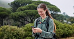 Hiking, explore or happy woman with phone in forest for direction, navigation or location online. Nature, smile or person on mobile in woods for social media on outdoor adventure, journey or travel