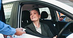 Car, woman and talking to traffic cop, patrol and asking driver for documentation, travel and justice. Smile, police officer and warning for mature person in vehicle, license or public safety on road