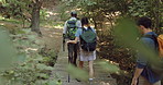 Back, hiking and people with fitness, environment and nature with hobby, recreation and wellness. Group, outdoor or men with women, ecology or break with countryside, vacation or trekking with cardio