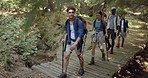 Travel, hiking and people with fitness, wellness and nature with hobby, recreation and environment. Group, outdoor and men with women, weekend break and trekking with countryside, vacation or explore