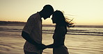Forehead, beach and couple with love, sunset and bonding together with vacation. Ocean, people or man with woman, seaside or romance with relationship, summer holiday or tropical island for honeymoon