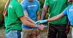 People, volunteer and hands together with community for eco friendly mission, unity or solidarity in nature. Group, social workers or piling with stack, applause or clapping for teamwork or earth day