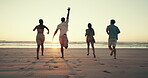 Running, back and friends on beach at sunset for holiday, summer vacation and adventure together. Nature, travel and men and women by sea, ocean and waves for freedom, happy and fun on weekend