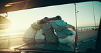 Back, hug and road trip with friends on car bonnet together for adventure, journey or travel. Beach, promenade and sunset with group of people embracing outdoor for bonding, holiday or vacation