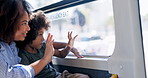 Mother, wave and child travel on bus with window, city commute and sightseeing adventure. Bonding, woman and curious son on public transport for family trip, discussion or journey on weekend break