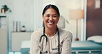 Happy woman, doctor and face in office at hospital with pride, confident and medical career. Person, smile and portrait for healthcare services, job and stethoscope at wellness clinic in Cambodia