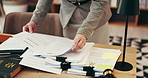 Person, hands and lawyer with documents for legal advice, testimonial or statements at office desk. Closeup, employee or attorney with paperwork for lawsuit, regulations or case notes at law firm
