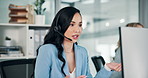 Customer service, business and woman on computer in office for talking, online help and consulting. Corporate communication, professional and person for contact, crm support and virtual assistant
