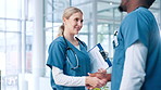 Handshake, nurses or doctors in hospital with documents for planning schedule or health treatment results. Meeting, teamwork or people shaking hands for medical advice, greeting or clinic research