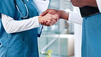 Handshake, nurses or doctors in hospital with closeup for medicine, appointment or health treatment results. Meeting, teamwork or people shaking hands for medical advice, greeting or clinic research