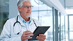 Doctor, tablet and thinking with man in hospital for review of information or medical records. Healthcare, stethoscope and telehealth with mature cardiology professional in clinic for results