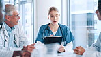 Doctor, nurse and discussion with tablet at hospital for healthcare results, treatment plan and report analysis. Medical staff, teamwork or people with online research for health procedure in meeting