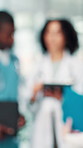 People, doctors and tablet for planning surgery, check test results and report for healthcare treatment collaboration. Medical team, blur and digital review of patient information, advice and help