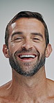 Laughing, face and skincare for man, studio and happy for glow of skin, cosmetics and dermatology. White background, smile and person with treatment for wellness, shine or aesthetic for beauty in USA