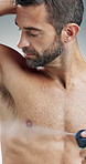 Happy man, face or hygiene with spray for fragrance, scent or aroma on a studio background. Portrait, male person or model with antiperspirant, perfume or smile for armpit, odor mask or body cologne