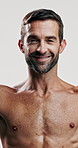 Studio, shirtless and skincare for man, happy and facial treatment for glow of skin and dermatology. White background, grooming and person with routine for self care, cosmetics and smooth face in USA