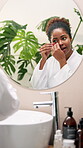 Beauty, eye patch and mirror with woman in bathroom for self care, glow and facial treatment. Cosmetics, grooming and collagen mask with person at home for dermatology, skincare and reflection