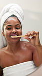 Woman, brushing teeth and dance by mirror, home and silly for cleaning mouth with hygiene in bathroom. African girl, bamboo toothbrush and happy for sustainability, oral health and playful at house