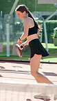 Sport, girl and playing padel on court with tournament match, serving ball and game agility. Fitness, athlete and club practice for tennis challenge, performance exercise and contest training outdoor