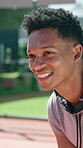 Athlete, man and happy on court for playing tournament, match practice and waiting for serve. Smile, tennis player and person for challenge training, performance fitness and competition workout