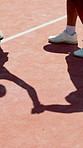 High five, shadow and tennis players on court for match, competition or workout with training. Fitness, silhouette and sports team with cheering for end of game, exercise or challenge at stadium.