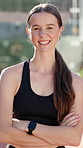 Woman, smile and arms crossed at tennis court with face for padel game, contest or ready for training in summer. Person, girl and happy athlete with pride, confident or fitness for sport in Argentina