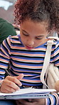 Writing, notebook and child on bus for travel with studying for education test on commute to school. Journal, girl and student learning for exam, assessment or project on public transport in city