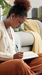 Woman, student and writing notes at house for studying, research and reminder of assessment. African person, notebook or laptop for schedule update, online learning and checklist of exams preparation