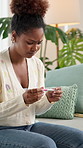 Black woman, worry and concern with pregnancy test on sofa for stress, anxiety or mistake at home. Female person, pregnant or stick with positive results, doubt or panic for maternity or abortion