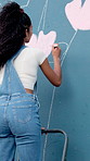 Ladder, woman and painting on wall for art, flower decor or happy student with creative design outdoor. City, color and artist with brush for mural, project and back for floral hobby with culture