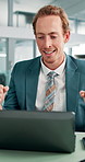 Man, laptop and success with fist pump in office, goals or revenue growth with dividend results. Person, broker and excited with cheers, target or increase profit on stock market at investment agency