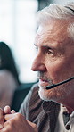 Mature man, call center and headset with discussion, advice and consulting with mic at office. Person, agent and customer support at help desk, contact us and listen with voip connection at workplace