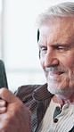 Laughing, entrepreneur and man with smartphone, office and browsing for funny videos on social media. Business, smile and mature person with mobile for entertainment, streaming and comedy on website