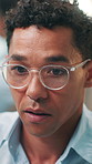 Business, glasses and man in office, online reading and creativity with contemplation. Person, journalist or consultant in workplace, eyewear and decision with ideas, email or copywriting with vision