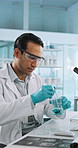 Science, liquid and man with beaker and pipette for research, medical analysis and chemistry in lab. Healthcare, biotechnology and scientist with solution for sample, experiment and development