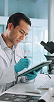 Tablet, scientist and man with pen for research, thinking or writing neurology report. Medical science, test or digital technology for medicine development, problem solving or healthcare study in lab