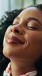 Woman, relax and headphones with sound in home for streaming music, calm podcast or mindfulness. African person, face or weekend break with audio subscription, listening to song or happy for wellness