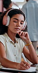 Headphones, library and woman student writing notes for research, knowledge or practice test. Education, college and female person study for exam with books, music or lecture podcast for assignment