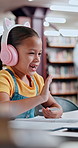 Happy girl, student or wave with headphones for video call, online course or elearning at library. Child, kid or distance learner with smile or pen for virtual classroom, lesson or remote interaction
