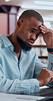 Black man, student and laptop in library with headache, stress and frustrated for exam. Person, computer and migraine at university campus for fatigue, tension and tired with research or assignment