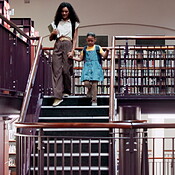 Woman, child and walking with books in library for information ...
