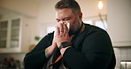 Sick man, chef and blowing nose with tissue for influenza, viral infection or virus at home. Male person, flu or cold with hayfever, sinus or allergy of illness for bacteria, germs or sneeze at house