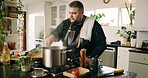Man, chef and kitchen with stove for cooking, meal preparation or hospitality service at home. Male person, influencer or private cater with pot or stir for food, culinary skill or dinner at house