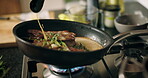 Cooking, hands and steak in frying pan in kitchen for meal preparation, sear beef cuisine or enhance flavor. Chef, person and meat recipe with herbs for healthy ingredients, nutrition or food in home