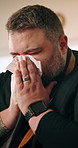 Man, tissue and sick in home with sneeze, flu virus and sinus congestion. Male chef, illness and toilet paper for cleaning with cold, covid symptoms and allergic reaction to spices with hayfever