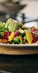 Cooking, salad and chef with plate of food for culinary, meal prep and dinner in restaurant. Kitchen, catering and person with healthy ingredients for nutrition, gourmet dish and cuisine recipe