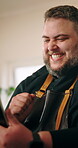 Man, home and tablet in kitchen with celebration, good news or success as entrepreneur. Happy male person, excited and technology for networking, review or recipe for cooking or meal preparation